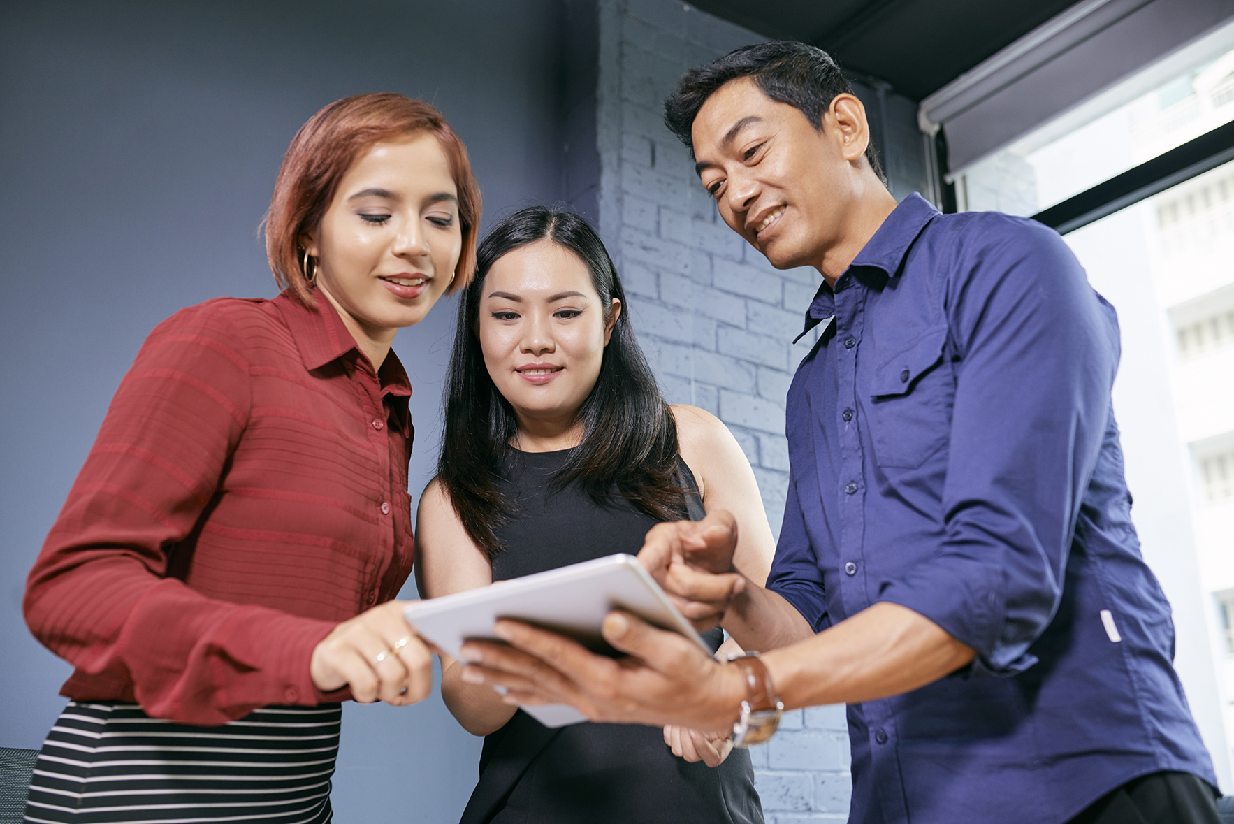 Business team discussing with tablet